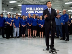 Ontario PC Leader Tim Hudak talks about high electricity rates at a packaging plant in Smithville, Ont., on Monday, May 12, 2014.