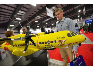 Turner Strang of the NRC checks out a model of a Boeing rescue aircraft as the annual trade fair for military equipment known as CANSEC took place at the EY Centre near the airport. Photo taken at 11:51 on May 28, 2014.