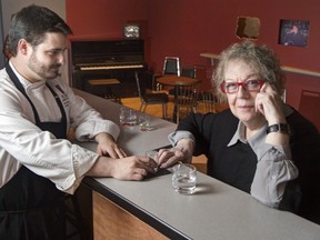 Artist Vera Frenkel sits in her installation, . . . from The Transit Bar," now back at the National Gallery after 18 years. ( Chris Mikula, Ottawa Citizen)