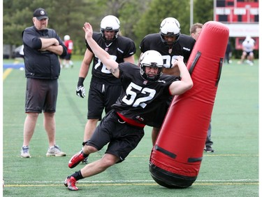 Vincent Desloges goes through defensive drills during the opening day for the Ottawa RedBlacks rookies training camp, May 28, 2014.