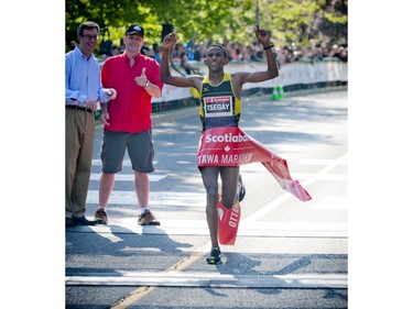 Yemane Tsegay crossed the finish line in first place for the marathon at Ottawa Race Weekend Sunday May 25, 2014.