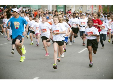 Youngsters hit the course full speed at the start line of the Kids Marathon during Ottawa Race Weekend Sunday May 25, 2014.
