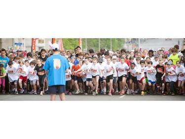 Youngsters line up to hit the course for the Kids Marathon during Ottawa Race Weekend Sunday May 25, 2014.