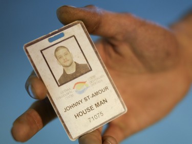 Johnny St-Amour shows his employee pass card which have been deactivated at the Ottawa Convention Centre on Sunday, June 1, 2014. Caissie and St-Amour are employees at the Ottawa Convention Centre but have been banned for refusing to cover up their tattoos.