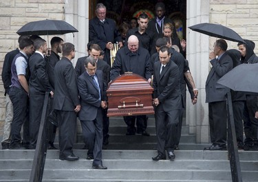 Pallbearers carry the casket of Brandon Volpi down the steps of St. Anthony's Church in Ottawa following his funeral on Friday, June 13, 2014. Volpi, a student at St. Patrick's High School was killed in a stabbing during his prom night in downtown Ottawa.