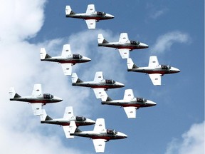 10.59 a.m. Snowbirds fly in formation over Gatineau Airport as part of a Vintage Wings of Canada event on Monday, June 30, 2014, but also in preparation for Canada Day.