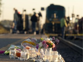 Area residents created a makeshift memorial near the scene of the September 2013 Oc Transpo-Via Rail crash in Ottawa.