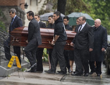 Pallbearers, including the Danny Volpi, second from right, carry the casket of Brandon Volpi into St. Anthony's Church in Ottawa for his funeral on Friday, June 13, 2014. Volpi, a student at St. Patrick's High School was killed in a stabbing during his prom night in downtown Ottawa.