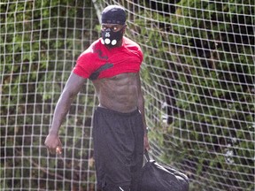 Carlton Mitchell uses a special mask to enhance his training.