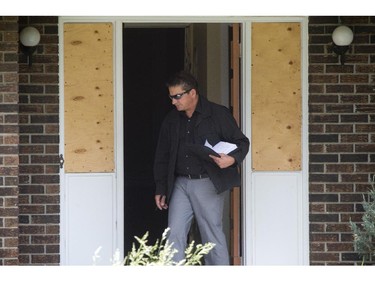 An investigator looks at the scene where two Ottawa police tactical officers and three paramedics have been injured in a joint-training exercise with the RCMP that was being conducted Wednesday morning on March Road in Kanata.