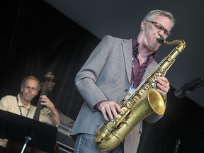 Saxophonist Kirk MacDonald, and Neil Swainson on bass, on the Main Stage of the 2014 TD Ottawa Jazz Festival. 
( Chris Mikula / Ottawa Citizen)