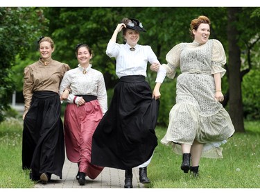 2.37 p.m., Wednesday, June 4, 2014.  Heritage interpreters (from left) Lindsay Curran, Bronwen Rowe, Tessa Kubanek and Amy Nyentap have a bit of fun while making their way across Watson's Mill Wednesday.  The foursome are part of a group of 10 interpreters, dressed in late 19th century finery, that adorn historic Dickinson Square in Manotick for the summer, hosting special events and giving tours.  This weekend the village celebrates its history with Dickinson Days.