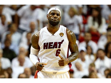 LeBron James #6 of the Miami Heat reacts against the San Antonio Spurs during Game Four of the 2014 NBA Finals at American Airlines Arena on June 12, 2014 in Miami, Florida.