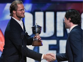 Chris Pronger of the Philadelphia Flyers presents Duncan Keith of the Chicago Blackhawks with the James Norris Memorial Trophy during the 2014 NHL Awards at the Encore Theater at Wynn Las Vegas on June 24, 2014 in Las Vegas, Nevada.