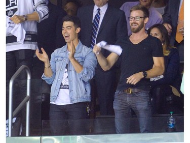 LOS ANGELES, CA - JUNE 13:  Joe Jonas (L) attends Game Five of the 2014 Stanley Cup Final between the Los Angeles Kings and the New York Rangers at the Staples Center on June 13, 2014 in Los Angeles, California.