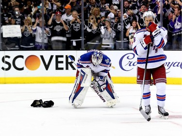 Goaltender Henrik Lundqvist #30 and Anton Stralman #6 of the New York Rangers react after being defeated by the Los Angeles Kings 3-2 in Game Five of the 2014 Stanley Cup Final at Staples Center on June 13, 2014 in Los Angeles, California.