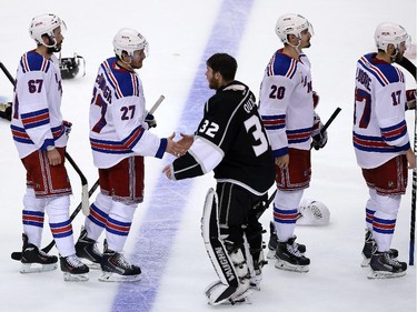 Ryan McDonagh of the New York Rangers shakes hands with goaltender Jonathan Quick of the Los Angeles Kings following Game Five of the 2014 Stanley Cup Final at Staples Center on June 13, 2014 in Los Angeles, California.