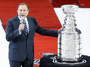NHL Commissioner Gary Bettman presents the Stanley Cup to the Los Angeles Kings following Game Five of the 2014 Stanley Cup Final against the New York Rangers at Staples Center on June 13, 2014 in Los Angeles, California.