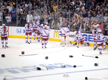 The New York Rangers stand on the ice after losing to the Los Angeles Kings 3-2 in double overtime during Game Five of the 2014 Stanley Cup Final at Staples Center on June 13, 2014 in Los Angeles, California.
