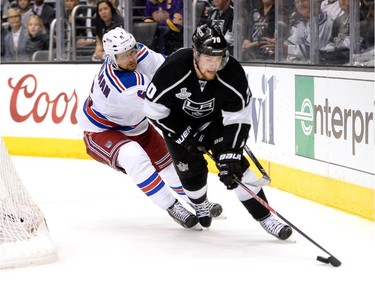 LOS ANGELES, CA - JUNE 13:  Tanner Pearson #70 of the Los Angeles Kings with the puck against Anton Stralman #6 of the New York Rangers in overtime during Game Five of the 2014 Stanley Cup Final at Staples Center on June 13, 2014 in Los Angeles, California.