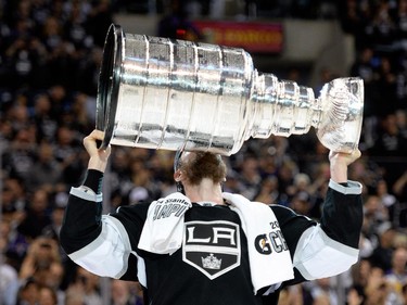 Jeff Carter of the Los Angeles Kings kisses the Stanley Cup in celebration after defeating the New York Rangers 3-2 in double overtime of Game Five of the 2014 Stanley Cup Final at Staples Center on June 13, 2014 in Los Angeles, California.