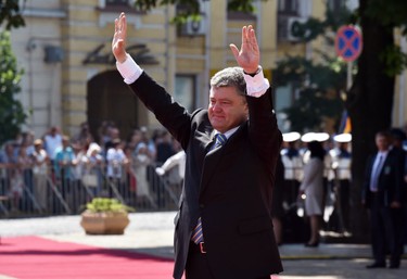 New Ukraine President Petro Poroshenko salutes people during a ceremony of his inauguration in Kiev on June 7, 2014. Poroshenko was sworn in as Ukraine's fifth post-Soviet president, vowing to maintain the unity of his country amid a continuing crisis with Russia.