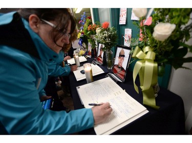 A book of condolence is signed at the Codiac RCMP detachment in Moncton, N.B. on Friday, June 6, 2014 to pay respect to the three RCMP officers who were killed and the two injured in a shooting spree on Wednesday. Justin Bourque, 24, is facing three charges of first-degree murder and two charges of attempted murder.THE CANADIAN PRESS/Sean Kilpatrick