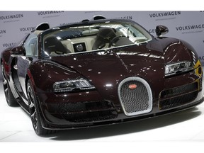 A Bugatti Veyron can top 400 km/h and costs $2.5 million -- the perfect wheels for a $32M lottery winner.