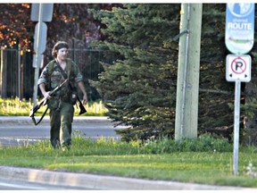 Heavily armed man Justin Bourque during last year's shooting rampage in Moncton, New Brunswick.