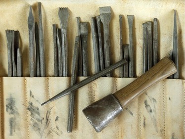 A leather pouch of chisels used daily at the shop. The ancient trade of stonemasonry is making a revival on Parliament Hill, and Danny Barber and John-Philippe Smith (founders of Smith and Barber stonemasons in Ottawa) are two of the mason/sculptors recreating the stone carvings there.