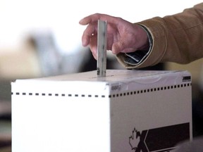 A man casts his vote for the 2011 federal election in Toronto in this May 2, 2011 photo.