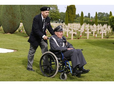 A Polish veteran arrives to participate in the French-Polish Commemoration D-Day Ceremony at the Polish cemetery in Urville-Langannerie, in Normandy, France, Friday,  June 6, 2014. World leaders and veterans gathered by the beaches of Normandy on Friday to mark the 70th anniversary of World War Two's D-Day landings.