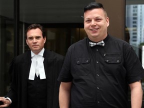 After being found not guilty, a happy Elliott Youden -- along with his lawyer Ian Carter (left) -- emerges from the Elgin St. courthouse in Ottawa, Wednesday, June 4, 2014. Youden was found not guilty of aggravated sexual assault in regards to whether he disclosed his HIV positive status prior to a sexual encounter in July 2010.