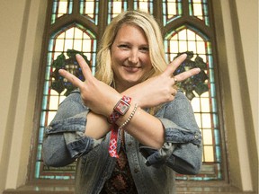 Allison Shalla, director of marketing for the Ottawa Bluesfest, shows off the new RFID wristbands that will allow spectators to connect to social networks, add a credit card and enter into contest to take advantage of on-site promotions.