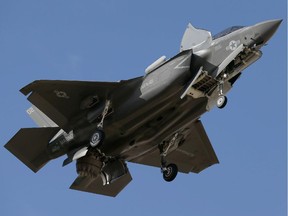 An F-35B fighter jet, the U.S. Marine Corps' variant of the F-35, soars above Arizona in this December, 2013 photo.