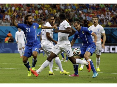 Italy's Andrea Pirlo, left, appeals for a penalty during the group D World Cup soccer match between England and Italy at the Arena da Amazonia in Manaus, Brazil, Saturday, June 14, 2014.