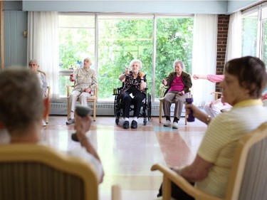 Anna Dazé, the New Orchard Lodge's President of the Resident's Association, takes part in an exercise class at the residence on Tuesday, June 10, 2014.