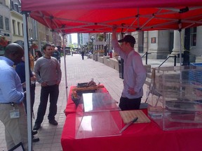 Art Is In Bakery, manned on Friday by Ty Simpson, right, is the last stand standing at the Sparks Street Market. Nine other vendors used to fill the stretch of pavement behind the stand.