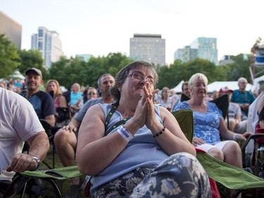 Audience members look on as Ben Harper and Charlie Musselwhite perform on the Main Stage at the Ottawa Jazz Festival on Friday, June 27, 2014.