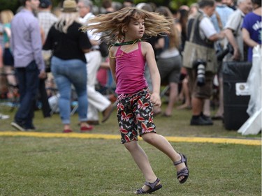 Bella Cerejido, 8, dances as Aretha Franklin performs on the Main Stage at Confederation Park during the Ottawa Jazz Festival in Ottawa on Saturday, June 28, 2014.