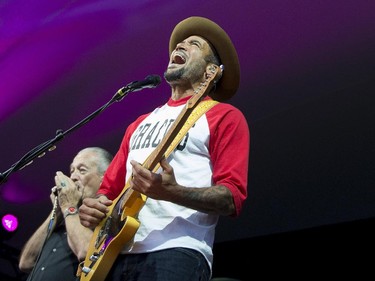 Ben Harper, right, performs with Charlie Musselwhite on the Main Stage at the Ottawa Jazz Festival in Ottawa on Friday, June 27, 2014. Justin Tang/Ottawa Citizen