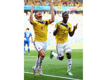 Teofilo Gutierrez of Colombia (L) celebrates scoring his team's second goal with Cristian Zapata during the 2014 FIFA World Cup Brazil Group C match between Colombia and Greece at Estadio Mineirao on June 14, 2014 in Belo Horizonte, Brazil.