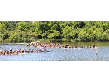 Boats race to the finish (line) at the Dragon Boat Festival at Mooney's Bay on Saturday.