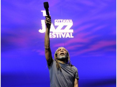 Bobby McFerrin invites the crowd to join him as he performs on the Main Stage at Confederation Park during the Ottawa Jazz Festival in Ottawa on Sunday, June 29, 2014.