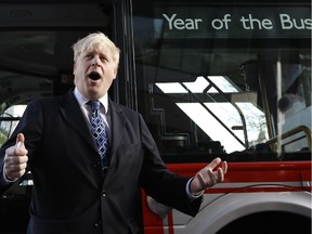 Boris Johnson the Mayor of London  stands in front of a routemaster bus to launch the Year of the Bus campaign, in London, Monday, Jan. 27, 2014.