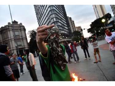 A demonstrator gestures during a protest against the 2014 FIFA World Cup in Belo Holizonte on June 12, 2014.