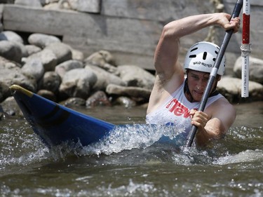 Cameron Smedley from the Canadian National Team competes in the Kayak (K1) Men category at the first Ontario canoe slalom race of the year, at the Pumphouse downtown Ottawa on June 29, 2014. Many of these paddlers have hopes of representing Ontario at the PanAm games in 2015, while others are local recreational paddlers racing for the first time.