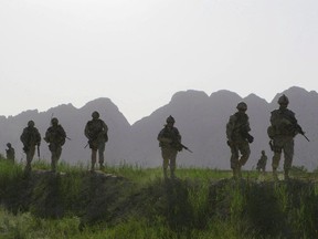 Canadian soldiers patrol an area in the Dand district of southern Afghanistan on Sunday, June 7, 2009. Canadian units that fought in Afghanistan are being considered for battle honours by the Harper government, which is casting around for ways to commemorate the conflict as it draws to a close after more than a decade.