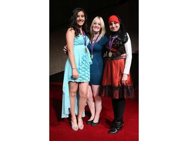 Cappies nominees for Sets, Megan Hooper (L), Sydney LeBreton (M) and Malak Issa (R), A.Y Jackson Secondary School, arrive on the Red Carpet, prior to the start of the 9th annual Cappies Gala awards, held at the National Arts Centre, on June 08, 2014, in Ottawa, Ont.