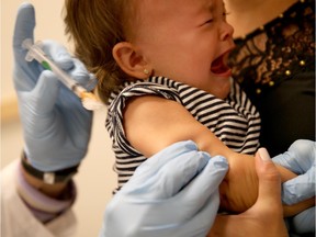 Febrile seizures are a rare side effect of measles-mumps-rubella vaccine, occurring at a rate of less than two seizures per 10,000 doses.